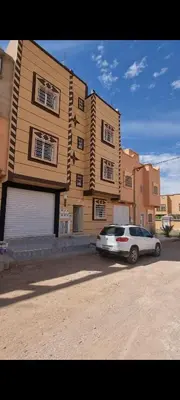 a white car parked in front of a building at إقامة الخال للشقق المفروشة الرشدية in Er Rachidia