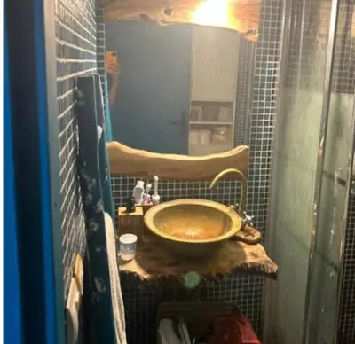 a bathroom with a sink and a mirror at cosy appartement calme in Oulad Akkou