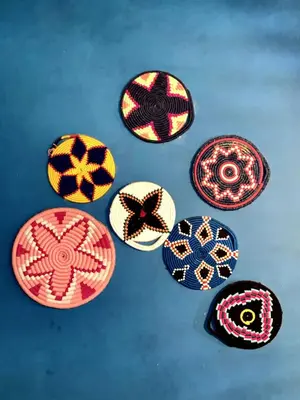a group of different colored plates on a table at cosy appartement calme in Oulad Akkou