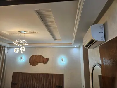 a bathroom with a ceiling with a sign on the wall at Villa des Perles in Marrakech