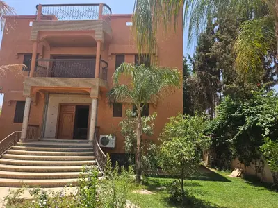 a building with stairs leading up to the door at Villa des Perles in Marrakech