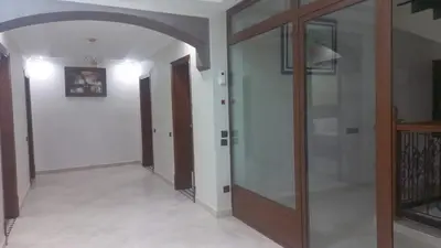 a hallway with a glass door in a house at Villa des Perles in Marrakech