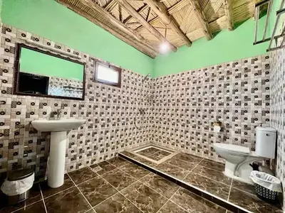 a bathroom with a sink and a toilet at Home khamlia in Merzouga