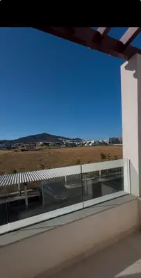 a window on a building with a view of a car at Appartement in Oulad Akkou