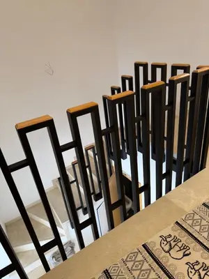 a row of chairs lined up against a wall at luxurious Taghazout duplex in Oulad Akkou