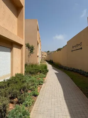 a sidewalk next to a building next to a building at luxurious Taghazout duplex in Oulad Akkou