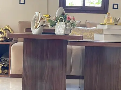 a table with shoes and flowers on top of it at dar marwa in Fès