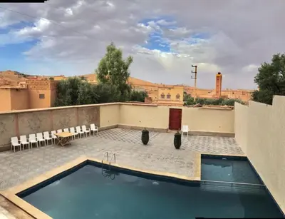 a swimming pool on the roof of a building at Hotel KASBAH DADES MGOUN in Kalaat MGouna