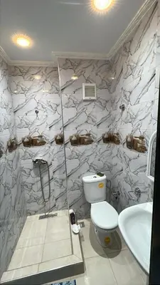 a bathroom with a toilet and a sink at cozy stay in Oulad Akkou