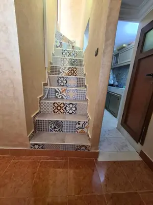 a staircase in a house with tiles on it at House Silya in Oulad Akkou