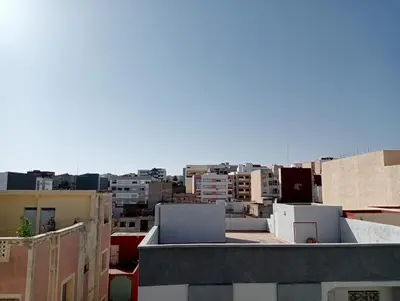 a view of a city from the roof of a building at Kinan in Fès