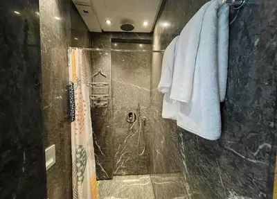 a bathroom with a shower with a glass door at Luxury Modern Studio with Netflix, Kitchen and Free Parking Elite Garden, Marrakesh in Aït Saïd