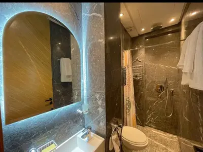 a bathroom with a shower and a toilet and a sink at Luxury Modern Studio with Netflix, Kitchen and Free Parking Elite Garden, Marrakesh in Aït Saïd