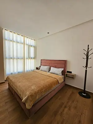 a bedroom with a large bed and a window at appartement luxueux khenifra 1 in Khenifra
