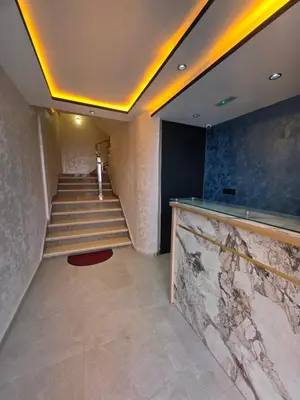 a staircase in a building with a marble counter at appartement luxueux khenifra 1 in Khenifra
