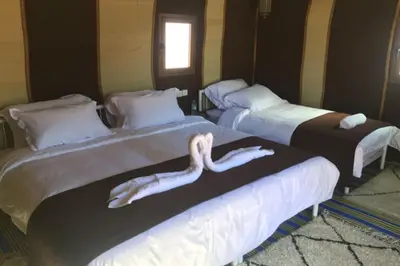 two beds in a room with a mermaid on them at Host Luxury Camp in Merzouga