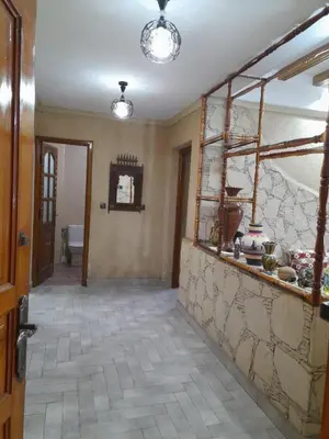 a hallway of a home with a stone wall at Village al baraka in Oulad Akkou