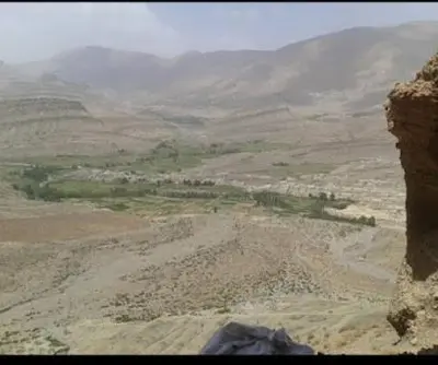 an aerial view of a valley in a mountain at Almarkaz Assiyahi