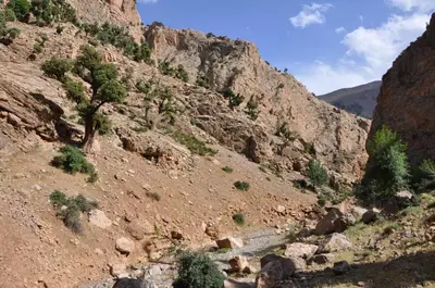 a mountain with a river in a canyon at Almarkaz Assiyahi