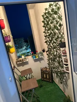 a view of a balcony with a plant on the wall at Appartement a louer meknes in Meknès