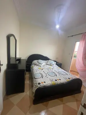 a bedroom with a bed in a room at Saidia in Oulad Akkou