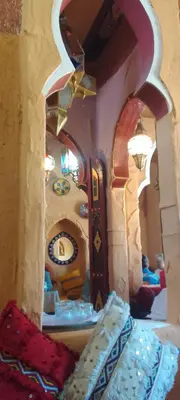 a view of a room with a clock in a room at desertcamp in Merzouga