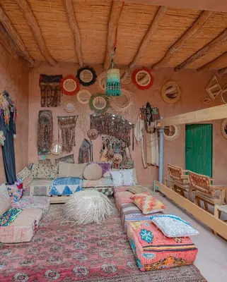a room with beds and pillows on the wall at Riad Azelia