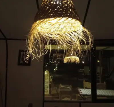 a light that is hanging from a ceiling at lion Desert luxury Camp in Merzouga