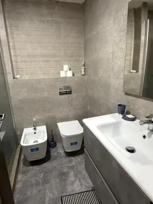 a bathroom with a sink and a toilet at Appartement in Oulad Akkou