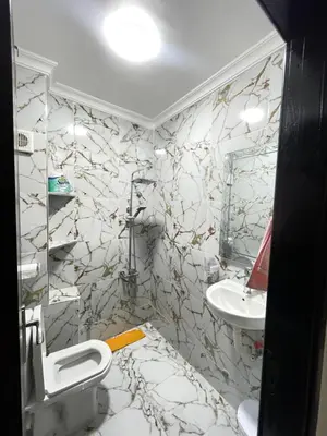 a bathroom with a toilet and a sink at Cala iris in Oulad Akkou