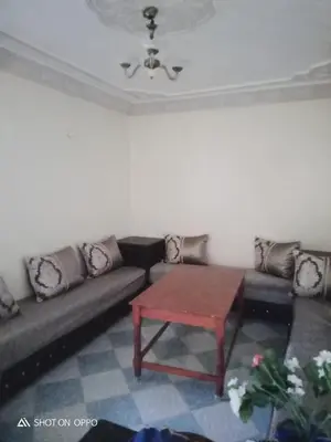 a living room with a couch and a table at Essaouira Mogador in Oulad Akkou