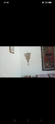 a picture of a wall with paintings on it at Cabanon à louer à Mohammedia in Oulad Akkou