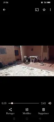 two pictures of a room with a table and a room with a table at Cabanon à louer à Mohammedia in Oulad Akkou