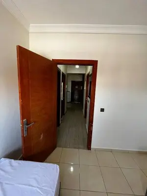 an empty room with a door and a hallway at appartement Marrakech in Oulad Akkou