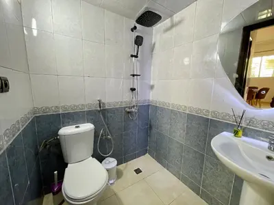 a bathroom with a toilet and a sink at Book your stay at Stay Day apartment in Fez in Fès