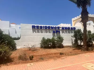a sign for a residence area in a building at RESIDENCE SAIDIA AGDAD ap1 in Oulad Akkou