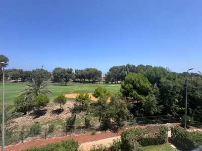 a view of a golf course with trees at RESIDENCE SAIDIA AGDAD ap1 in Oulad Akkou