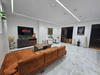 a living room with a couch and a tv at Villa house 24 in Najem