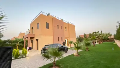 a black car parked in front of a building at Villa house 24 in Najem