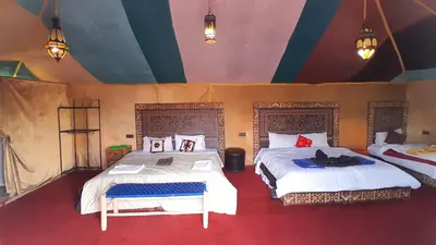 two beds in a room with two beds sidx sidx sidx at moon luxury Dessert camp in Merzouga