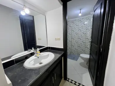 a bathroom with a sink and a toilet at Diamond Fes Apartment in Fès
