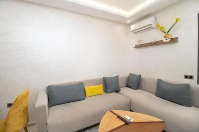 a living room with a couch and a table at Mds1 in Oulad Akkou