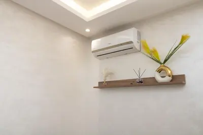 a bathroom with a shelf with a air conditioner at Mds1 in Oulad Akkou