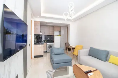a living room with a couch and a table at Mds1 in Oulad Akkou