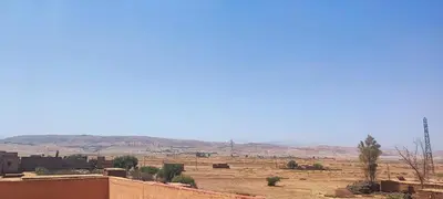 a view of a desert with mountains in the background at DAIFLAH Guesthouse & Hostel