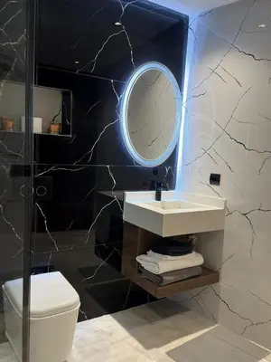a bathroom with a sink and a mirror at Appartement Studio in Oulad Akkou