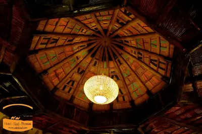 a chandelier hanging from the ceiling of a building at Luxury camps merzouga in Merzouga