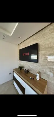a television on a wall in a room at New luxury appartement in Oulad Akkou