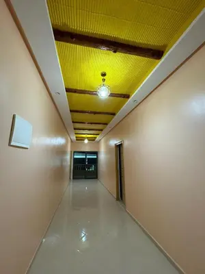 an empty hallway with a yellow ceiling in a building at Cafe Restaurant Moove Oil in Rissani