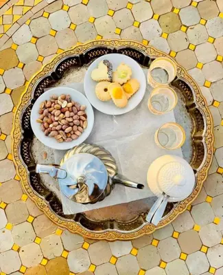 a table with plates of food and bowls of food at Cafe Restaurant Moove Oil in Rissani